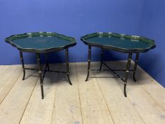 Pair of decorative green and gilt painted lacquered coffee tables, with scrolling edges to the