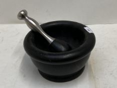 A large Pestle and Mortar