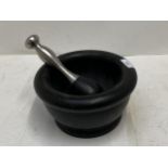 A large Pestle and Mortar