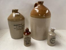 Two stoneware flagons with local provenance: stamped WH Haynes, Wholesale Grocer Swindon; and