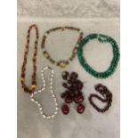 Collection of beaded jewellery, graduated cherry amber strand, uniform double strand of malachite