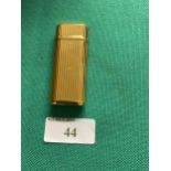A Cartier gold plated lighter, Swiss made, good condition