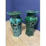 A pair of C20th tall green lustre painted Chinese style pillar seats, with circular tops