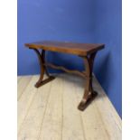 A narrow mahogany hall side table, with double splayed legs united by central stretcher