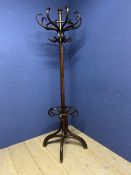 A wooden column hat/coat stand in the bentwood style