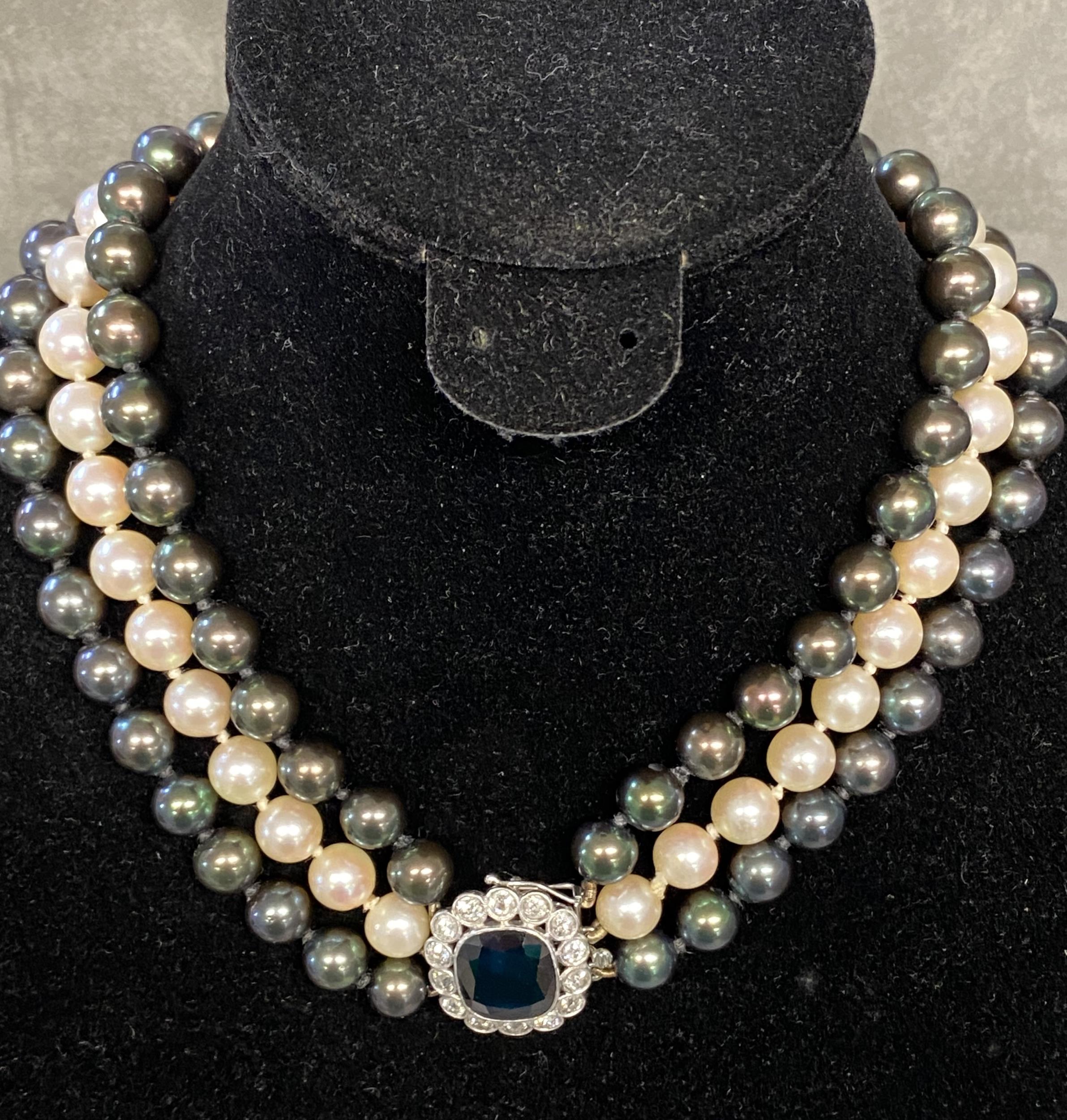 Triple strand of graduated Tahitian pearls of purple, green and white hues, largest pearl is 10mm