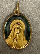 Unmarked yellow metal and zircon pendant, of a religious scene possibly signed E Vernan, with French