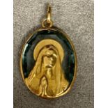 Unmarked yellow metal and zircon pendant, of a religious scene possibly signed E Vernan, with French