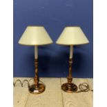 Pair of decorative lamps with cream shades