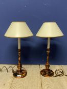 Pair of decorative lamps with cream shades