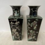 A pair of Chinese style tall vases, square body to fluted neck, decorated black ground and all