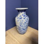Large blue and white Bow vase, cracks to base