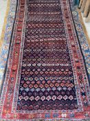 Persian rug runner, with all over red ground and stylized borders, approx. 142 x 292cm