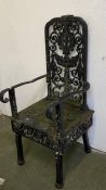 A heavy decorative wrought iron high backed iron chair, the seat inscribed "Class 2 to weigh 5cwt,