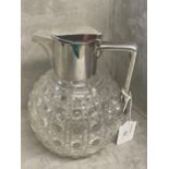 Sterling silver mounted cut glass claret jug, of bulbous form with star cut base, height, 18cm High