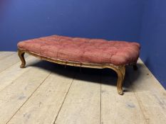 Red upholstered show framed stool, with cabriole legs, much wear. 118cm x 67cm x 31 cm