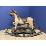 Small wooden painted rocking horse