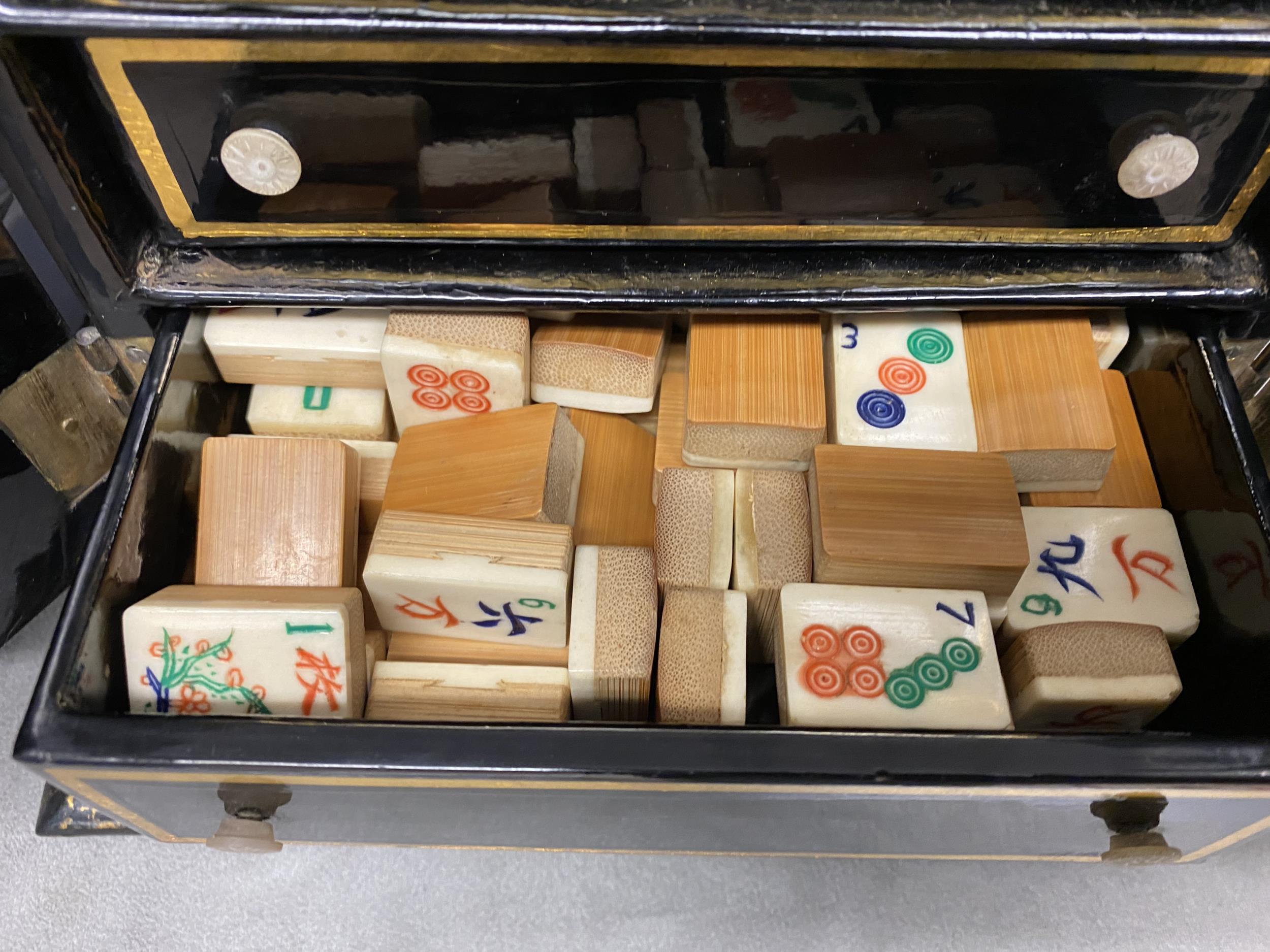 C19th/C20th wood & bone Mah Jong set in a black lacquered floral & gilt decorated 2 door papier - Image 5 of 10