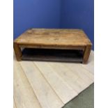 A rustic style two tier low centre table, 4 plank top, with shelf under 149 x 97 x 46 cm H