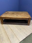 A rustic style two tier low centre table, 4 plank top, with shelf under 149 x 97 x 46 cm H