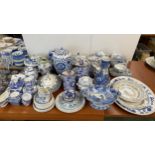 A quantity of good, decorative blue and white wares, including part tea services, dishes and covers,