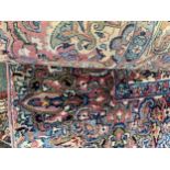 A large rug with all over stylized pattern in multi colours