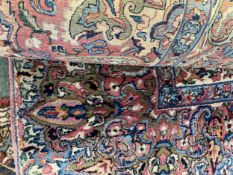 A large rug with all over stylized pattern in multi colours