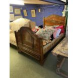 Single bed, with wooden head and foot board, decoratively painted with garlands of flowers and