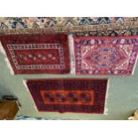 Four rugs, 1 large with blue, black and cream squares, and 3 others, 194 x 285; 63x90;151x95; 67x103