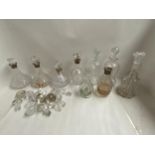 Quantity of decanters, including five with Hallmarked silver collars and various stoppers