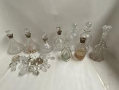 Quantity of decanters, including five with Hallmarked silver collars and various stoppers