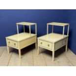 Pair of yellow and green painted two tier bedside tables, with brass handles