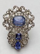 Late C19th/early C20th Sapphire and diamond brooch, set with 3 free cut sapphires, central untreated