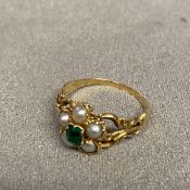 Unmarked C19th yellow metal emerald and split pearl mourning ring, with quartz panel to reverse,