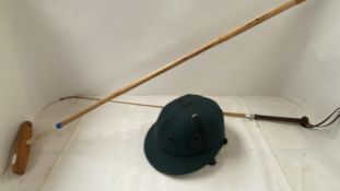 A polo stick, a green polo hat (auctioneers cannot guarantee this hat meets safety standards) & a