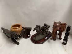 Bronze model of Arkle, wooden elephant, and model of racehorses on wooden plinth