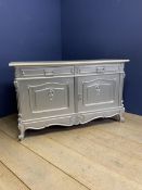 A metallic grey painted ornate French style sideboard, with a cream marble stepped top, decorated