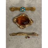 A turquoise and seed pearl bar brooch, and another yellow metal bar brooch and a paste set brooch