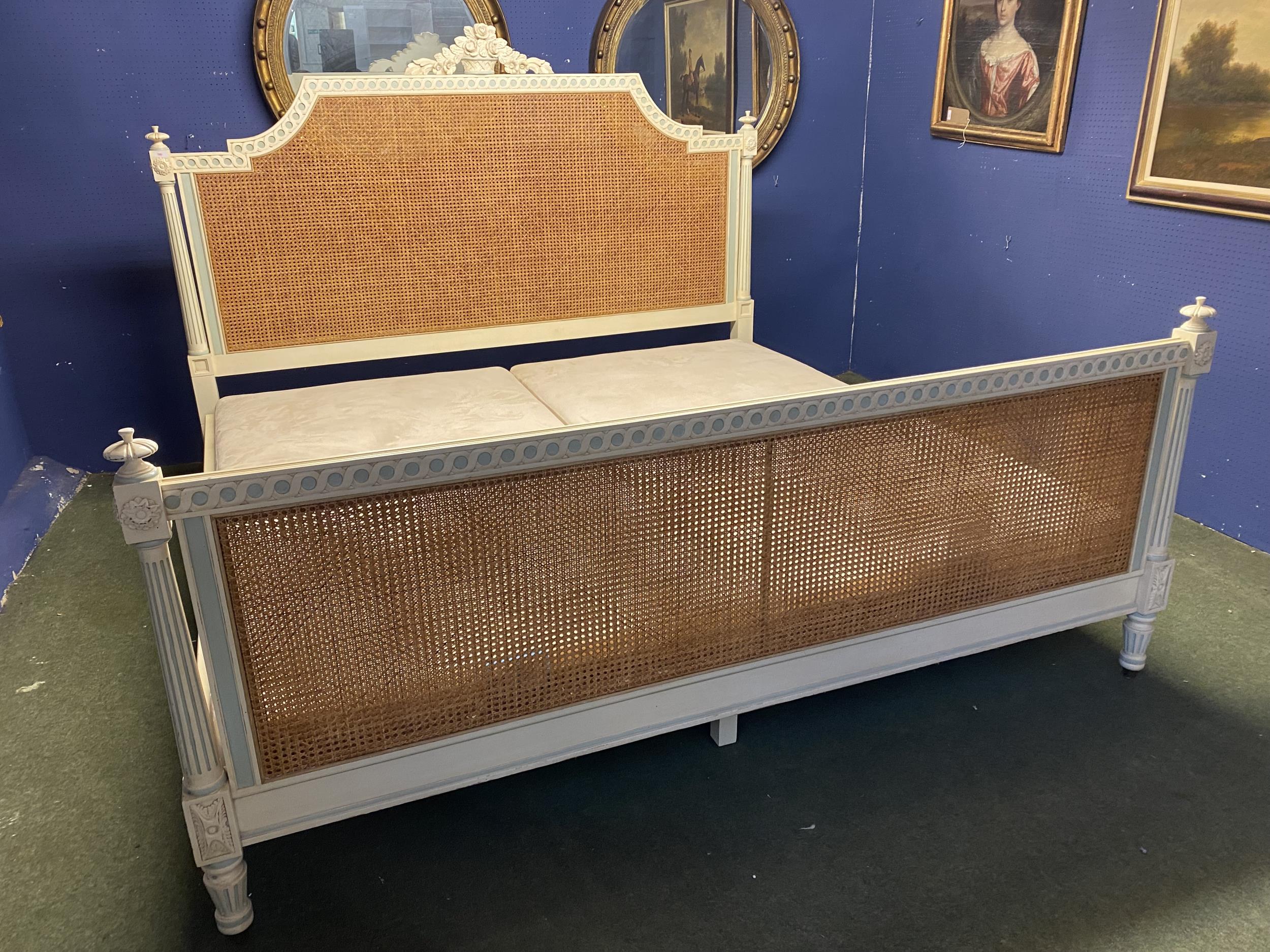 An elegant, Emperor size painted and bergère, double caned (at the base), "And So To Bed", London,