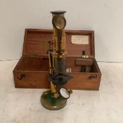 A cased wooden microscope