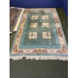 Chinese washed rug, turquoise ground with square panels illustrating birds and fauna 275 x 183 cm]