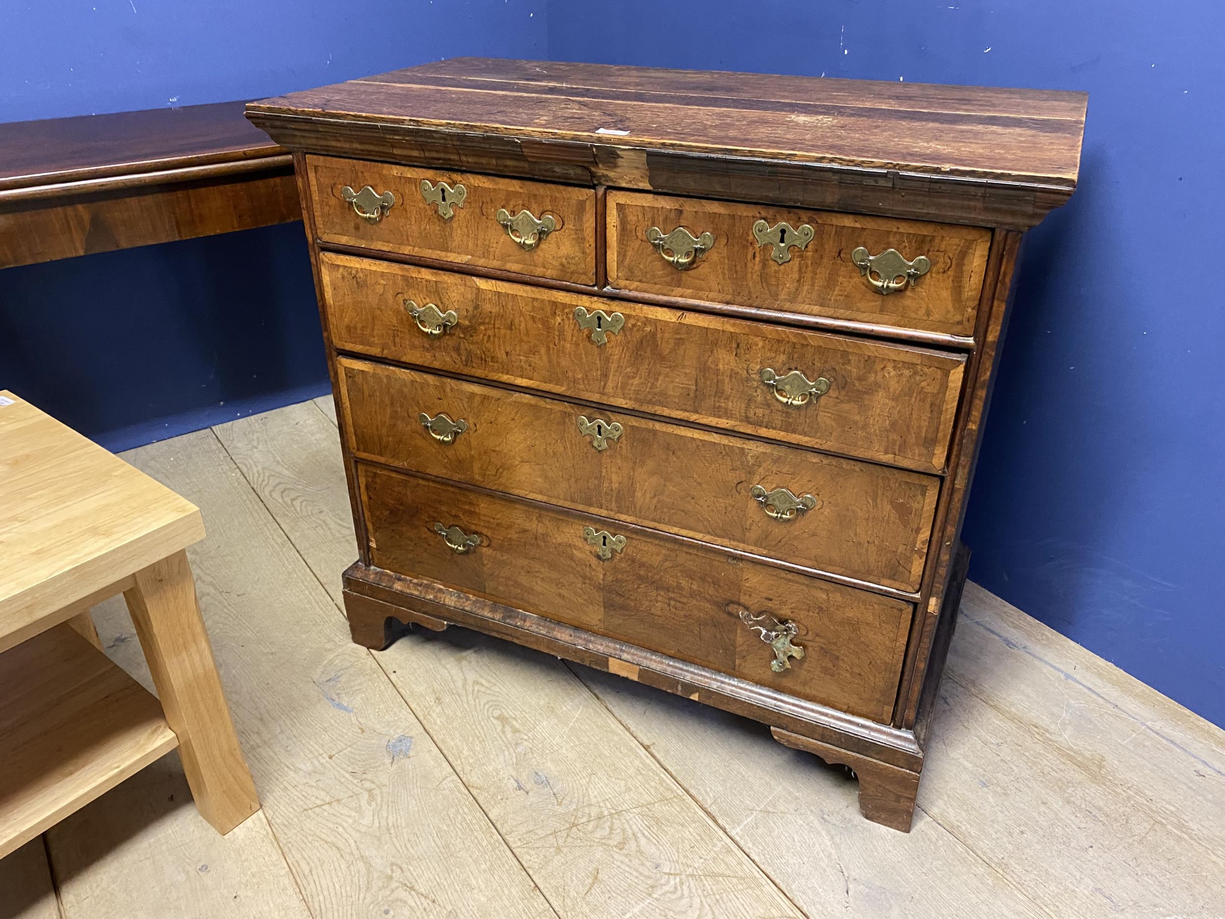 A George III feather banded walnut chest of 2 short over 3 long drawers, with an oak top, for - Image 7 of 12