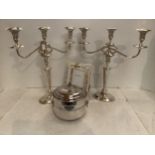 A pair of plated 3 branch candlesticks, and a photo frame and ice bucket with tongs