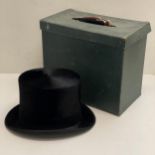 Black silk top hat, Tress & Co, London, small size. In a Dunn and Co fitted hat box