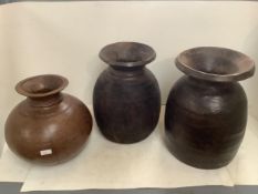 Three decorative wooden bulbous carved vessels/pots