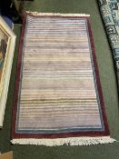 Modern rug, in pinks, cream, purple stripes, and brown borders, 93 x 155cm