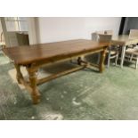 A heavy pine dining table with stretcher to base 218 cm long 107 cm wide