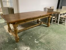 A heavy pine dining table with stretcher to base 218 cm long 107 cm wide