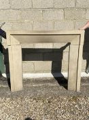 A modern stone fire surround ( in 3 separate pieces), some wear/damage