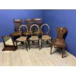 A C19th solid mahogany hall chair with painted panel, six other chairs and a toilet mirror